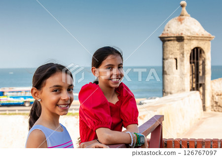 Beautiful young girls tourist in Cartagena de Indias. Colombian people. Travel concept. Real sisters. 126767097