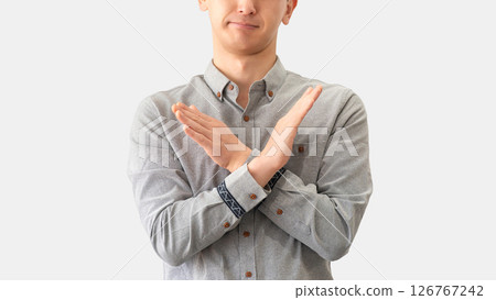 Male businessman making a cross pose with his hands 126767242