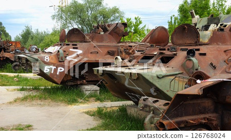 Rusty and burned-out armored vehicles on ukrainian territory. Exhibition of destroyed military equipment of the russian army. War between Ukraine and russia. Close up Slow motion 126768024