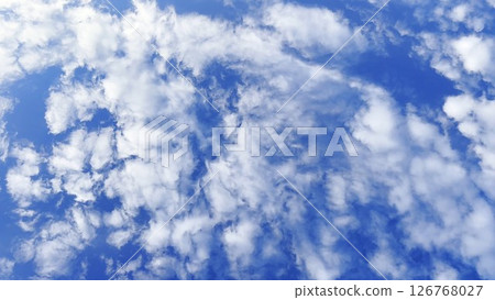 Camera move behind white fluffy clouds on blue sky at summer sunny day. Beautiful nature background. Close up Slow motion Camera move behind white fluffy clouds on blue sky at summer sunny day. Beautiful nature background. Close up Slow motion 126768027