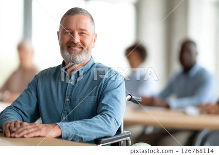 Confident Middle-Aged Man in Wheelchair at Business Meeting 126768114