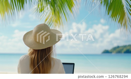 Woman Typing on Laptop at Seaside Woman Typing on Laptop at Seaside 126768294