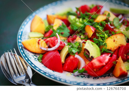 Fresh spring salad witn avocado, tomato, peach, red onion and herbs Fresh spring salad witn avocado, tomato, peach, red onion and herbs 126768708