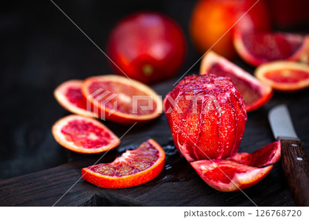 Fresh ripe red blood oranges (sicilian) on dark background 126768720