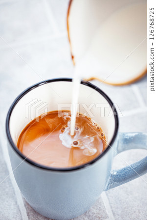 Hot black americano coffee and pouring milk 126768725
