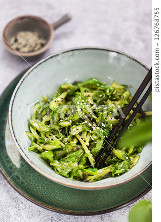 Asian style chuka wakame seaweed or sea mustard, cucumbers, green lettuce and sesame seeds fresh salad Asian style chuka wakame seaweed or sea mustard, cucumbers, green lettuce and sesame seeds fresh salad 126768755