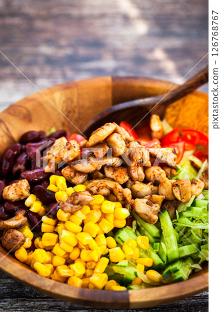 Fresh tomato, cucumber, beans, corn and chicken salad, mexican style, close-up Fresh tomato, cucumber, beans, corn and chicken salad, mexican style, close-up 126768767