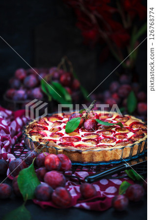 Fresh homemade plum tart or cake on dark background 126768774