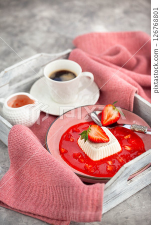Delicious Italian dessert Panna Cotta with strawberry sauce and fresh berries Delicious Italian dessert Panna Cotta with strawberry sauce and fresh berries 126768801