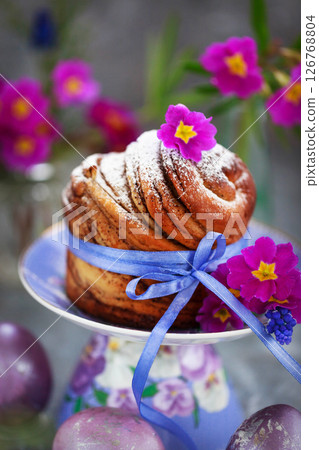 Sweet Easter bread, panettone or cruffin and colorful painted eggs, Holiday spring concept 126768804