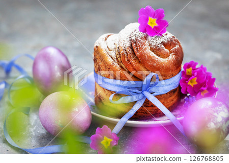 Sweet Easter bread, panettone or cruffin and colorful painted eggs, Holiday spring concept 126768805
