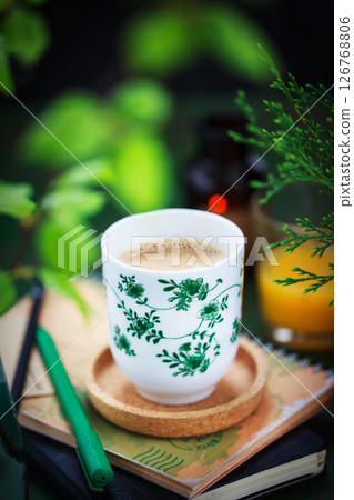 Cozy ceramic cup of cofee on spring background 126768806