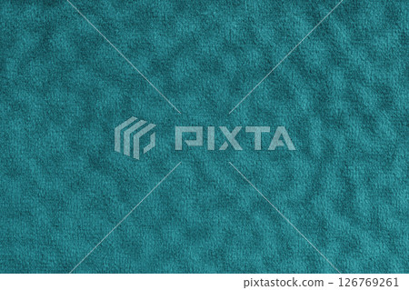 Faux fur , fluffy velours turquoise fabric, cloth macro texture with wavy effect, upholstery textile 126769261
