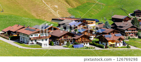 Scenic aerial alpine view austrian mountain village Kals am Grossglockner valley green rural farmland meadow horse pasture background. Austria Alp osttirol National park nature. Summer hiking tourism 126769298