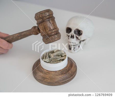 Judge Bangs Gavel. Chewing Tobacco Ban.  126769409