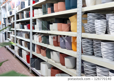 Colorful flower pots filling shelves in garden center Colorful flower pots filling shelves in garden center 126770140