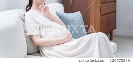 Thinking young pregnant woman 126770239