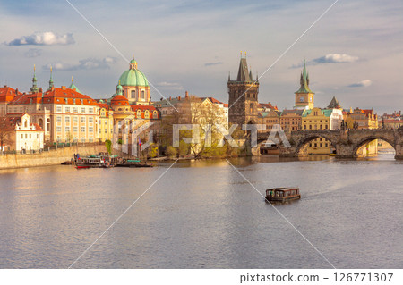 Charles Bridge and boat on Vltava River, Prague, Czech Republic 126771307