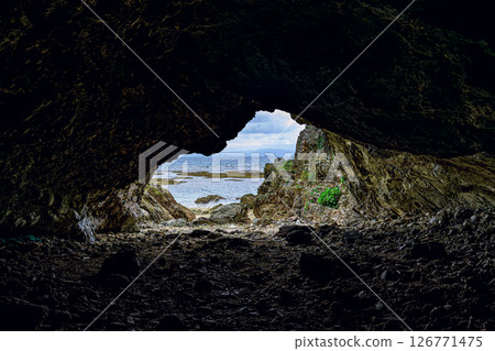 Mysterious sea view of Kannonzaki, Ishigaki Island, seen from inside a cave - a power spot Mysterious sea view of Kannonzaki, Ishigaki Island, seen from inside a cave - a power spot 126771475