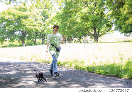 Walking a dog, running, Japanese woman and puppy, exercise Walking a dog, running, Japanese woman and puppy, exercise 126772627