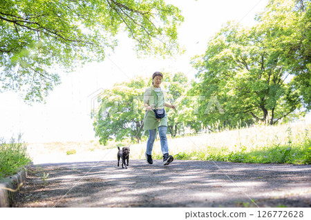 Walking a dog, running, Japanese woman and puppy, exercise Walking a dog, running, Japanese woman and puppy, exercise 126772628