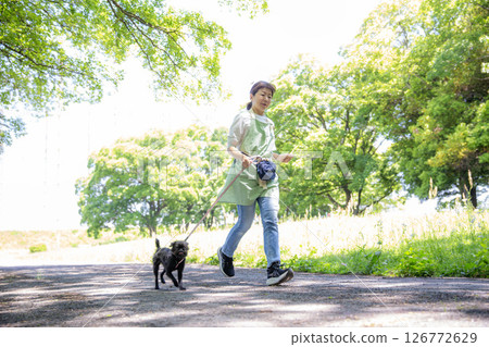 Walking a dog, running, Japanese woman and puppy, exercise 126772629