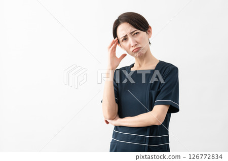 Young woman wearing beauty salon uniform Beauty image 126772834