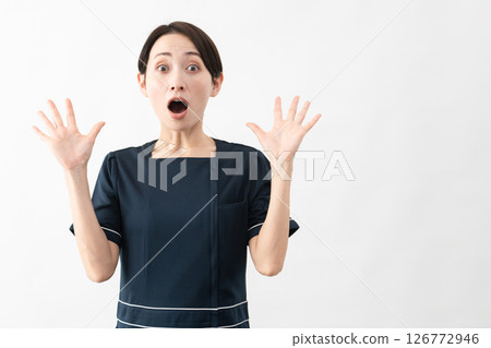 Young woman wearing beauty salon uniform Beauty image 126772946