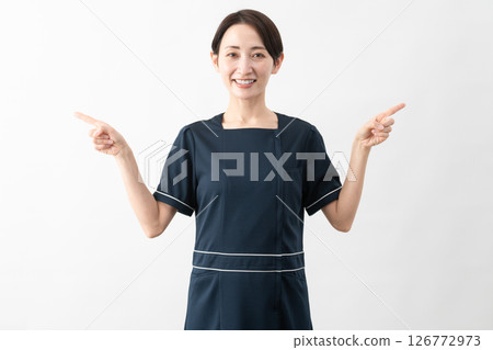 Young woman wearing beauty salon uniform Beauty image 126772973