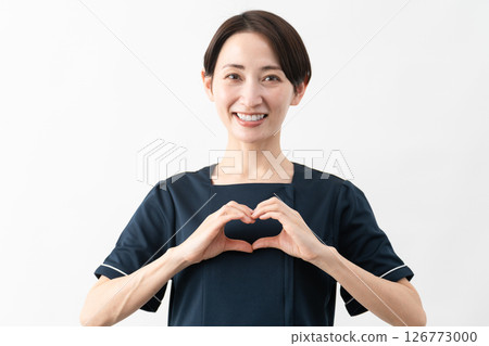 Young woman wearing beauty salon uniform Beauty image 126773000