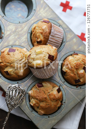 Freshly baked apple and cheese muffins Freshly baked apple and cheese muffins 126773731