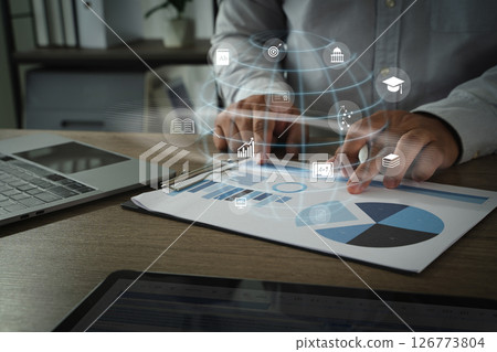 Online Business Coach person analyzing data charts and graphs paper with digital icons representing various educational and analytical concepts Online Business Coach person analyzing data charts and graphs paper with digital icons representing various educational and analytical concepts 126773804