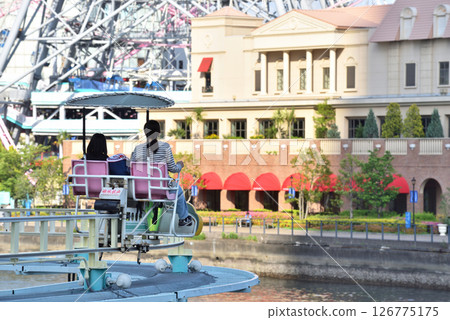 Two women enjoying an amusement park attraction 126775175