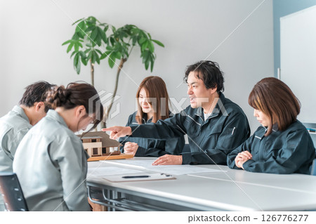 A businessman in work clothes getting angry at someone during a meeting, a conference, or a business negotiation (furious, scolding, preaching) A businessman in work clothes getting angry at someone during a meeting, a conference, or a business negotiation (furious, scolding, preaching) 126776277