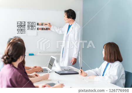 A male doctor who lectures at medical conferences, study sessions, seminars, training sessions, and workshops A male doctor who lectures at medical conferences, study sessions, seminars, training sessions, and workshops 126776998