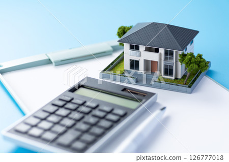 House, calculator and binder 126777018