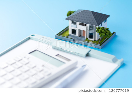 House, calculator and binder 126777019