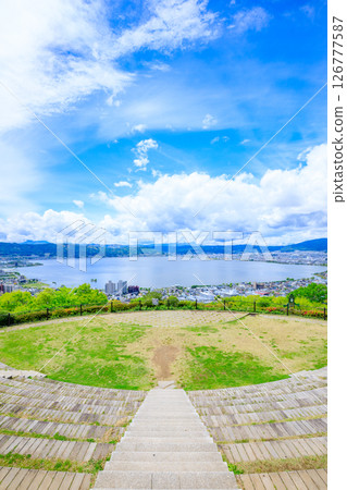 Lake Suwa seen from Tateishi Park in early summer, Suwa City, Nagano Prefecture 126777587