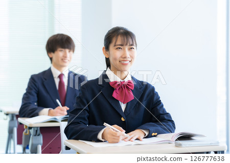 Male and female high school students studying at school. Photo courtesy of Denpa Gakuen Tokyo Electronics College 126777638