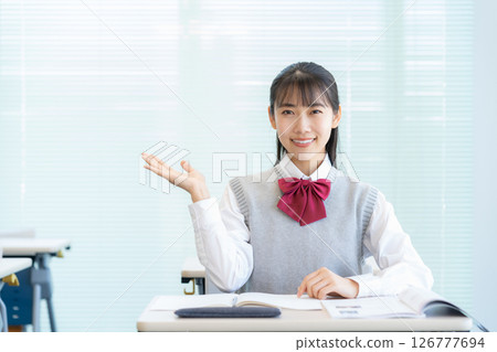 High school girls studying at school. Photo courtesy of Denpa Gakuen Tokyo Electronics College. 126777694