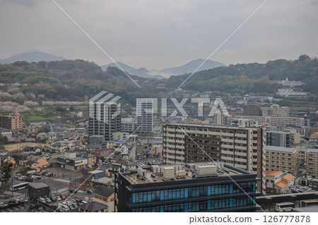 March 27 2025 Aerial View of Urban Landscape with Background Green Hills March 27 2025 Aerial View of Urban Landscape with Background Green Hills 126777878