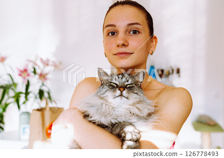 Portrait young woman with pet cat 126778493