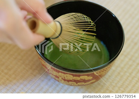The act of making tea in the Urasenke tea ceremony 126779354