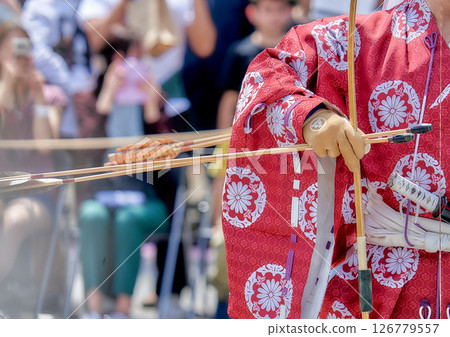 A woman in a yukata dancing at a festival 126779557