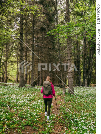 Female Walking in Flowering Wild Forest Clearing Female Walking in Flowering Wild Forest Clearing 126779700
