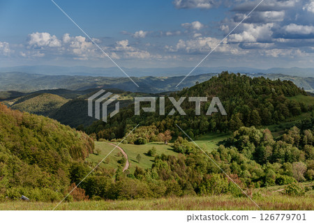 Mountain Landscape with Countryside Road in Povlen Mountains Mountain Landscape with Countryside Road in Povlen Mountains 126779701
