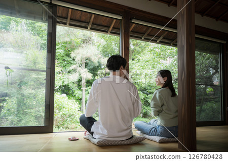 Couples relaxing on the veranda, travel image of a ryokan or inn, no faces 126780428