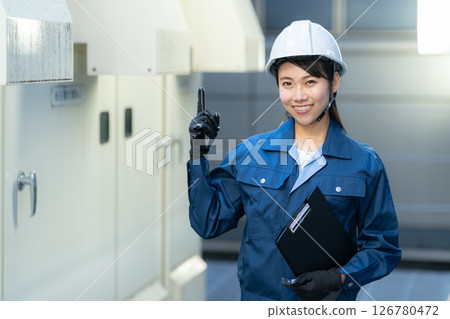 A female engineer performing building maintenance. Photo courtesy of Denpa Gakuen Tokyo Electronics College. A female engineer performing building maintenance. Photo courtesy of Denpa Gakuen Tokyo Electronics College. 126780472