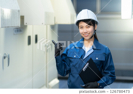 A female engineer performing building maintenance. Photo courtesy of Denpa Gakuen Tokyo Electronics College. A female engineer performing building maintenance. Photo courtesy of Denpa Gakuen Tokyo Electronics College. 126780473