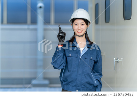 A female engineer performing building maintenance. Photo courtesy of Denpa Gakuen Tokyo Electronics College. 126780482